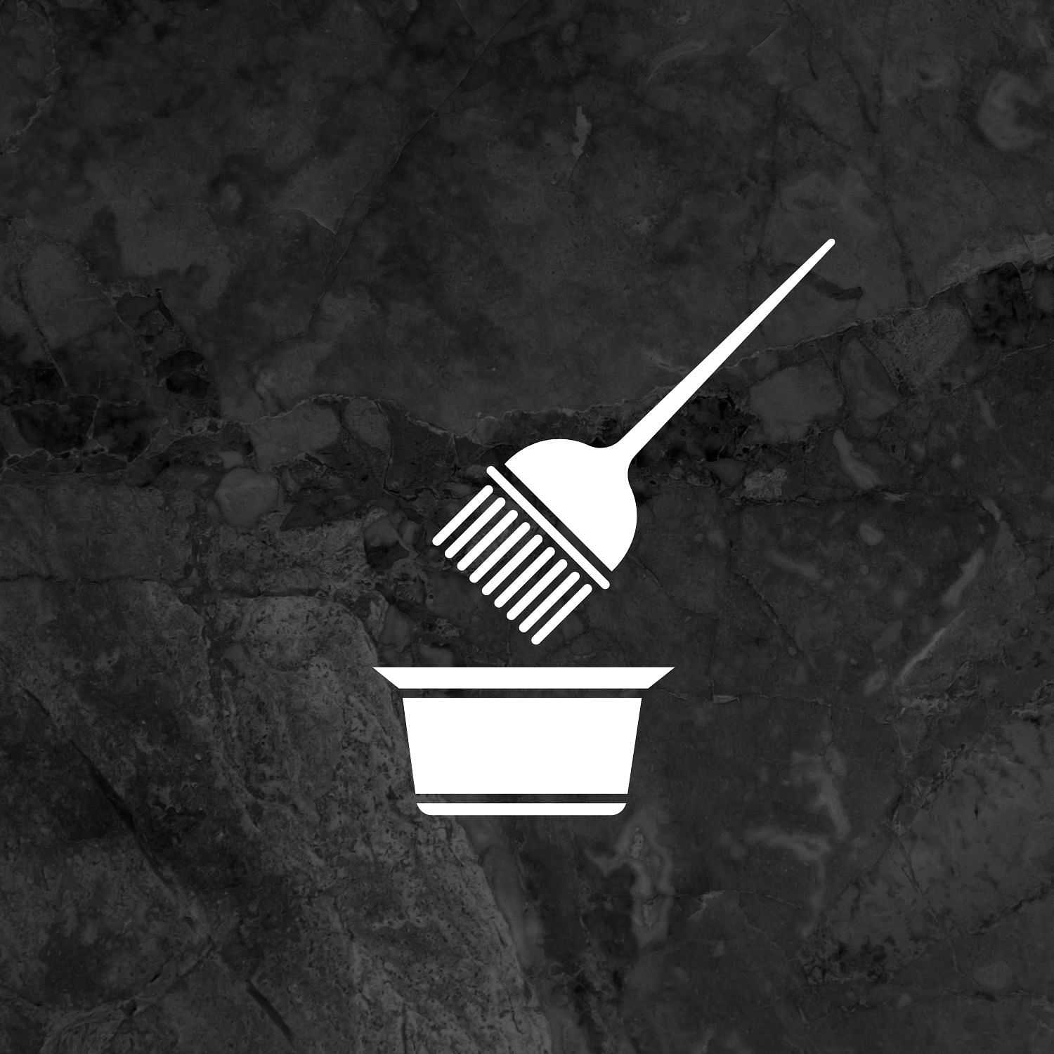 A fork over a takeout container icon on a dark marble background.