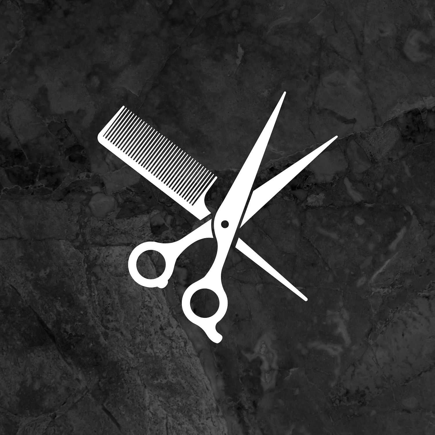 Scissors and comb silhouette on a cracked stone background.